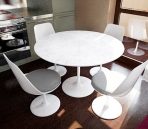 Combination of simple white tables and chairs (including maps)